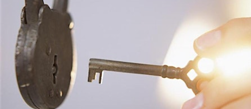 Photo of a key going into a lock