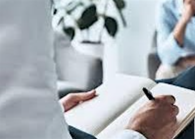 Photo of a person taking notes